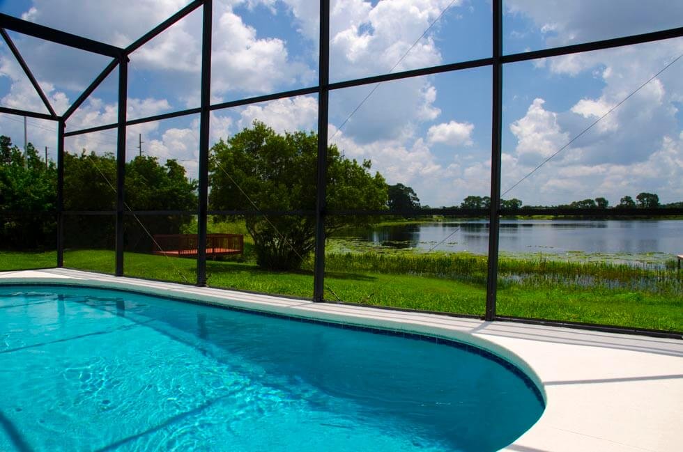 South-facing screened pool with loungers
